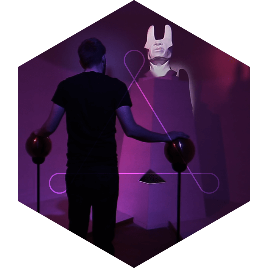 a person touching 2 orbs looking at a statue of quas